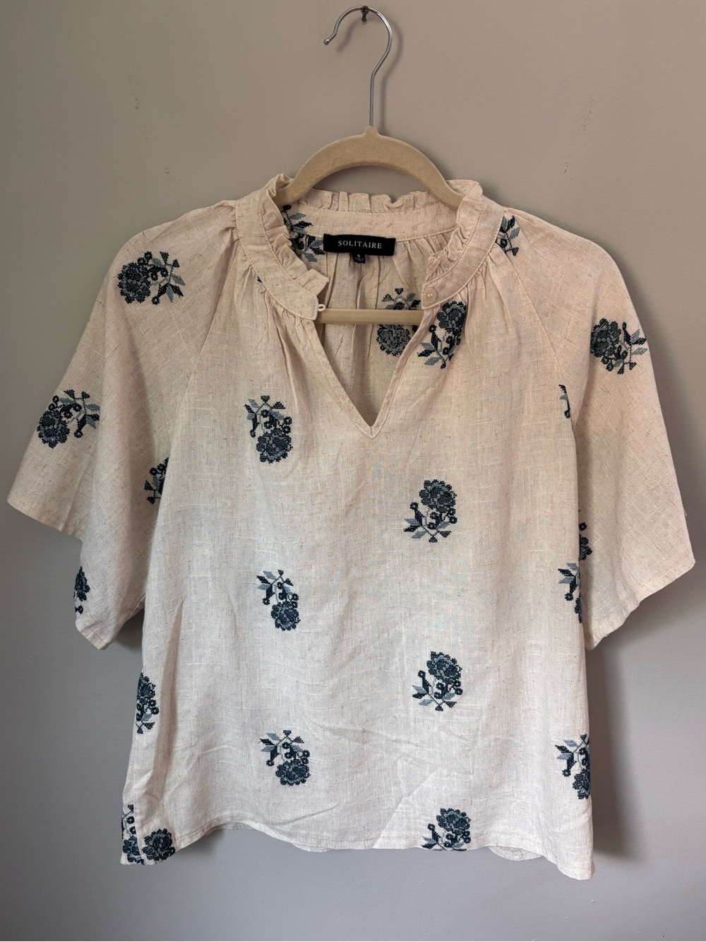 Solitaire Cream Top with Blue Floral Print and Ruffle Neck